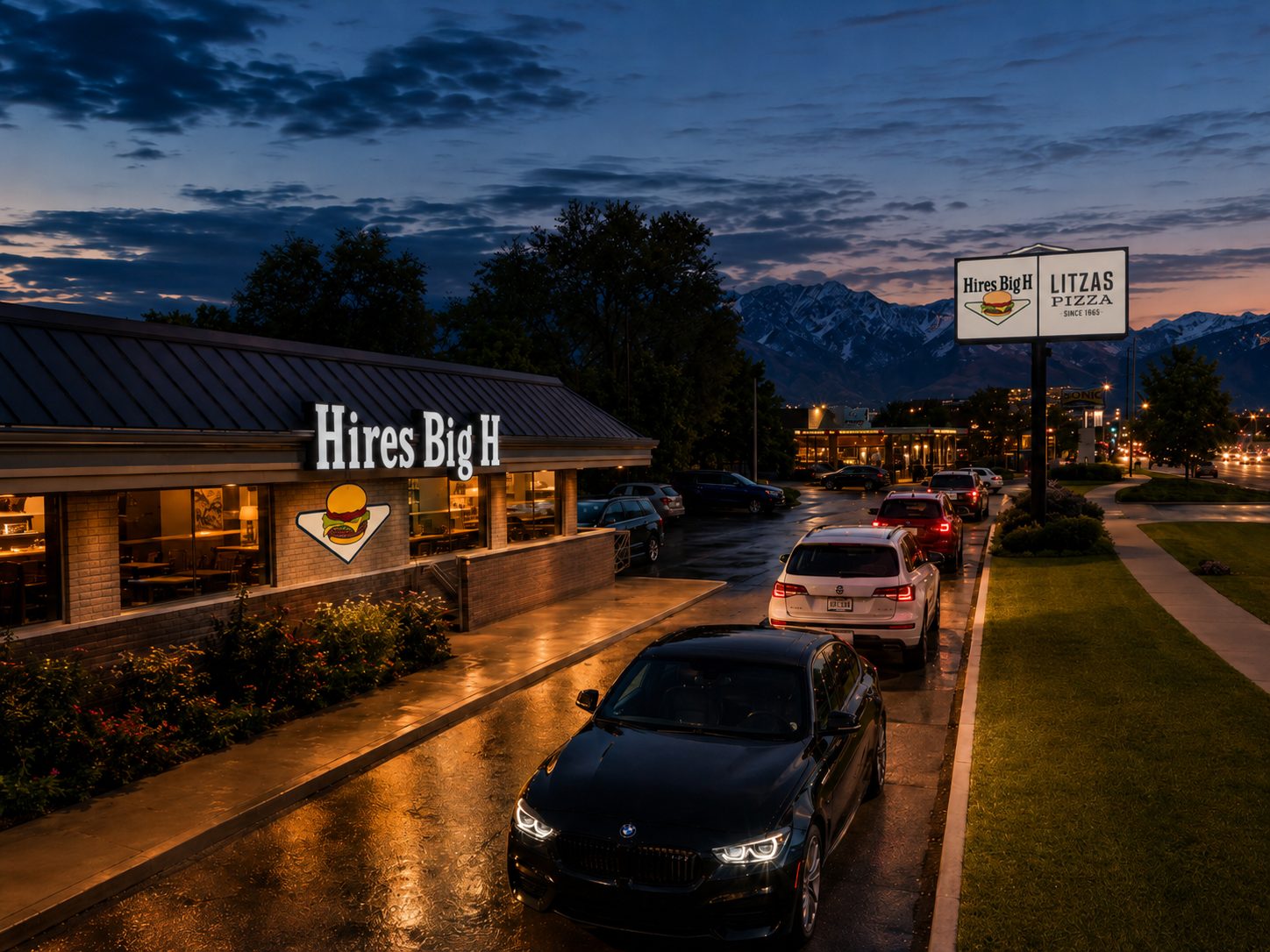 Hires Big H and Litzas Pizza at dusk, mountains behind, since 1965