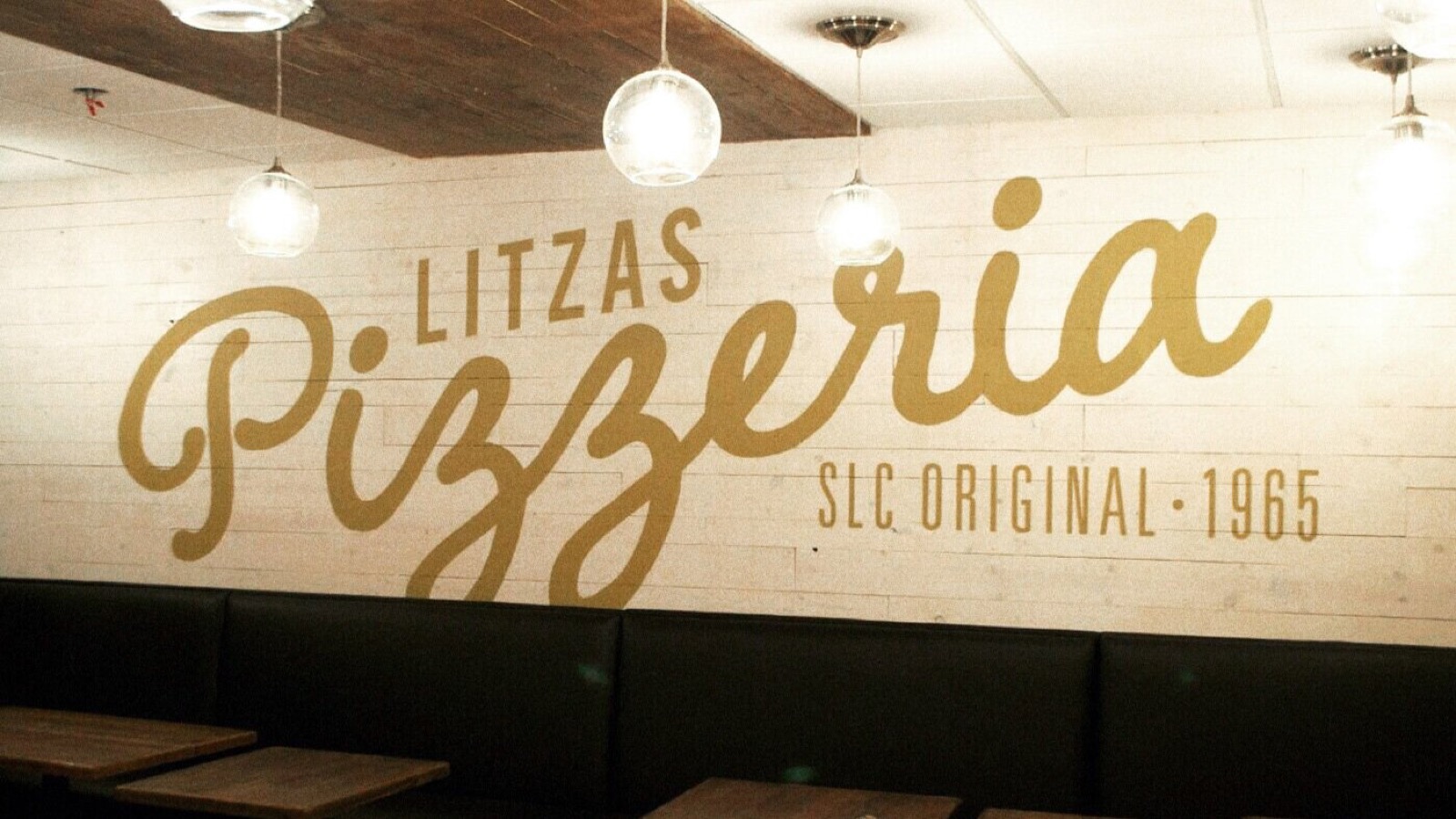 The gold Litzas mural inside the Salt Lake City restaurant